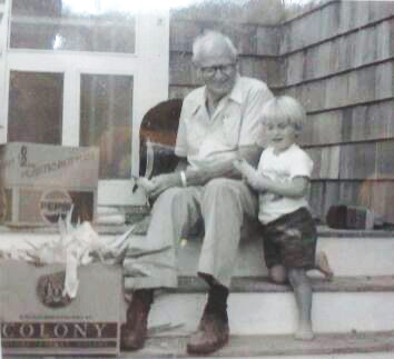 James Hedberg and Hollis Hedberg shucking corn at Cape Cod.